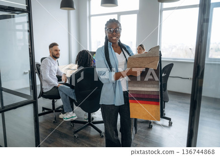 Palette of colors. Business people are working in the office 136744868