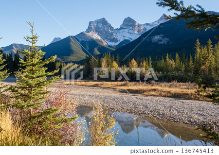 The Three Sisters and the beautiful Bow River. Canmore, Alberta, Canada The Three Sisters and the beautiful Bow River. Canmore, Alberta, Canada 136745413