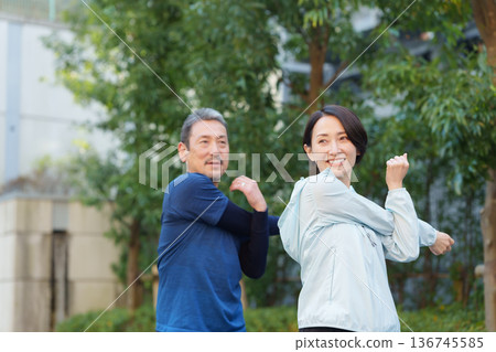 Men and women exercising 136745585