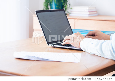 A man preparing to file his tax return 136746456