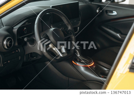 Steering wheel, front part. Detailed close up view of modern car interior Steering wheel, front part. Detailed close up view of modern car interior 136747013
