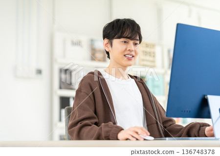 A young engineer man working in the office A young engineer man working in the office 136748378