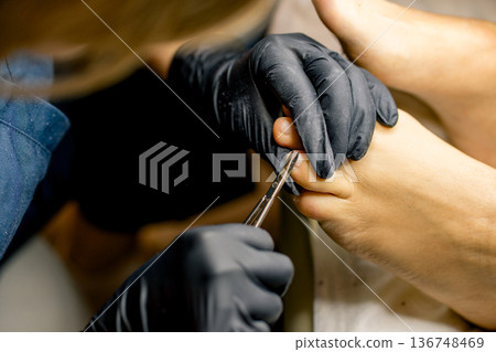 View of the process of a pedicure performed by a master 136748469