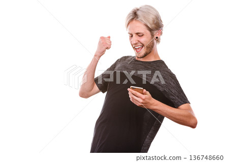 Happy man using mobile phone read message Happy man using mobile phone read message 136748660