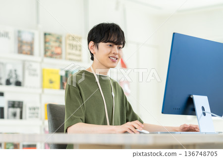 A young engineer man working in the office A young engineer man working in the office 136748705