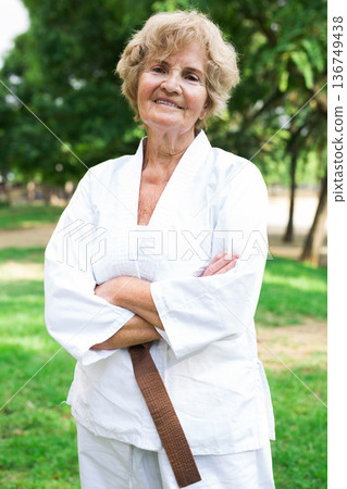 Mature woman in kimono outdoors Mature woman in kimono outdoors 136749438