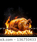 Grilled whole chicken on a spit over open flames, showcasing a delicious cooking process 136750433