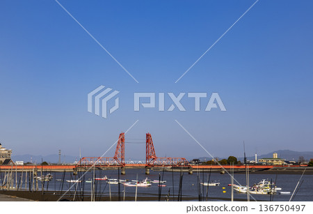 The Chikugo River Lift Bridge as seen from the fishing port on the Chikugo River The Chikugo River Lift Bridge as seen from the fishing port on the Chikugo River 136750497