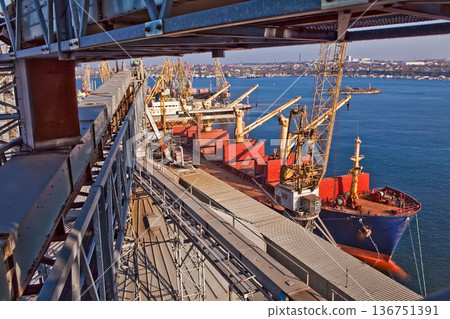 Industrial series of silver grain silos and port terminal logistics. Industrial series of silver grain silos and port terminal logistics. 136751391