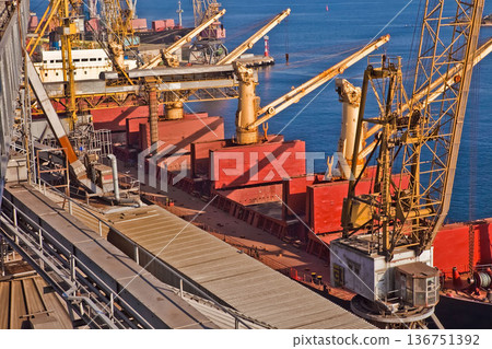 Industrial series of silver grain silos and port terminal logistics. Industrial series of silver grain silos and port terminal logistics. 136751392