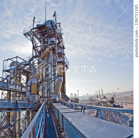Industrial complex for grain processing with steel silos and conveyor systems. Industrial complex for grain processing with steel silos and conveyor systems. 136751395