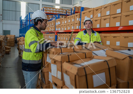 Warehouse worker working in warehouse storage.  136752828
