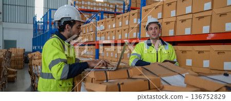 Warehouse worker working in warehouse storage.  136752829