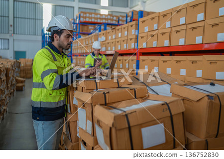Warehouse worker working in warehouse storage.  136752830