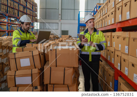 Warehouse worker working in warehouse storage.  136752831