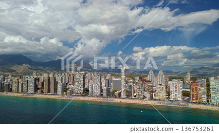 Aerial panoramic view of Benidorm beachfront skyline with Levante beach and Mediterranean coast Spain Aerial panoramic view of Benidorm beachfront skyline with Levante beach and Mediterranean coast Spain 136753261
