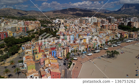 Aerial view of colorful houses and beachfront promenade in Villajoyosa coastal town Spain Mediterranean seaside Aerial view of colorful houses and beachfront promenade in Villajoyosa coastal town Spain Mediterranean seaside 136753262