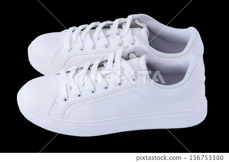 Pair of White Sneakers isolated on black background Pair of White Sneakers isolated on black background 136753380