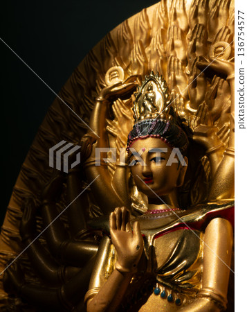 Ornate Golden Thousand-Armed Guanyin Bodhisattva Statue in Buddhist Temple Ornate Golden Thousand-Armed Guanyin Bodhisattva Statue in Buddhist Temple 136754577