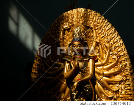 Ornate Golden Thousand-Armed Guanyin Bodhisattva Statue in Buddhist Temple Ornate Golden Thousand-Armed Guanyin Bodhisattva Statue in Buddhist Temple 136754613