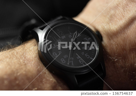 Close-up shot of a black tactical analog wristwatch Close-up shot of a black tactical analog wristwatch 136754637