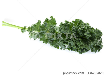 Fresh green leaves of Kale. Green vegetable leaves isolated on a white background. Fresh green leaves of Kale. Green vegetable leaves isolated on a white background. 136755829