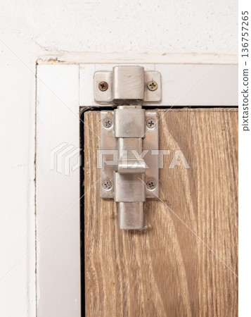 Stainless Steel Slide Bolt Latch on Wooden Door. Stainless Steel Slide Bolt Latch on Wooden Door. 136757265