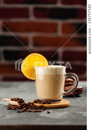 Coffee with orange slice on glass mug 136757380
