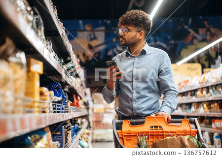 Searching for meal. Man is in the grocery store 136757612