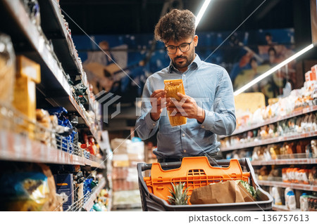 Searching for meal. Man is in the grocery store 136757613