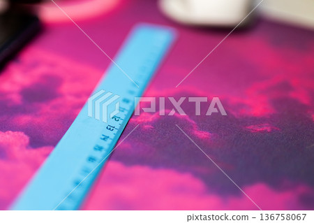 Artistic work environment lit by neon with vivid measuring equipment on patterned fabric Artistic work environment lit by neon with vivid measuring equipment on patterned fabric 136758067