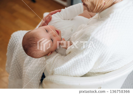 Wellness, holding kid. Grandmother with cute toddler baby at home 136758366