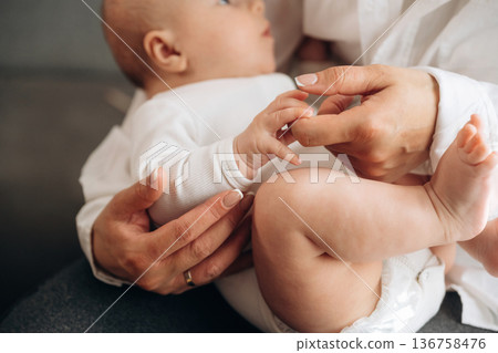 Breast feeding. Woman is with her little toddler baby daughter 136758476
