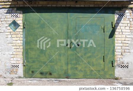 old metal warehouse door, hangar 136758596