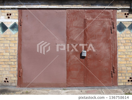 old metal warehouse door, hangar 136758614