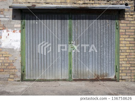 old metal warehouse door, hangar 136758626