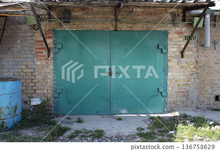 old metal warehouse door, hangar old metal warehouse door, hangar 136758629