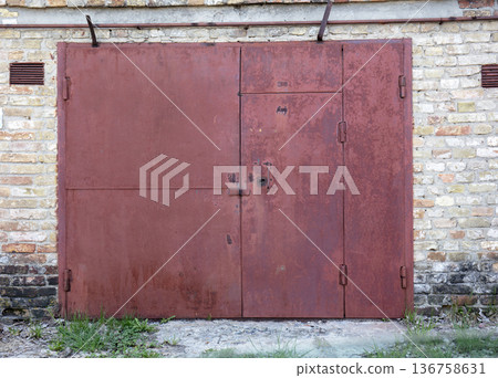 old metal warehouse door, hangar old metal warehouse door, hangar 136758631