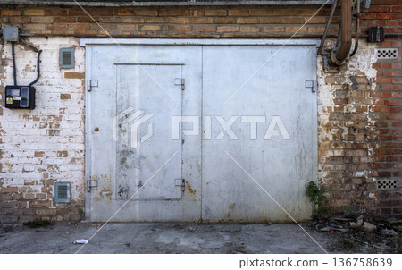 old metal warehouse door, hangar 136758639