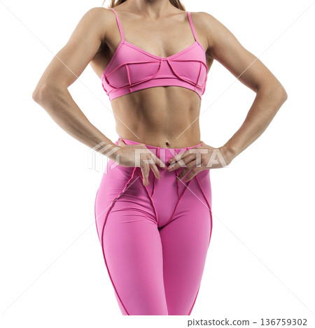 Athletic woman posing in pink sports bra and leggings with transparent background Athletic woman posing in pink sports bra and leggings with transparent background 136759302