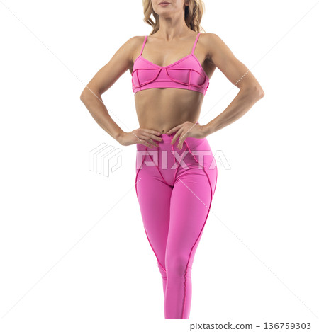 Athletic woman posing in pink sports bra and leggings with transparent background Athletic woman posing in pink sports bra and leggings with transparent background 136759303
