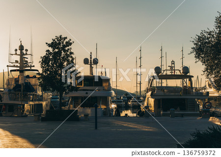 Amazing view of a marina and boats in Porto Montenegro on a sunset. Travel destination in Montenegro. Amazing view of a marina and boats in Porto Montenegro on a sunset. Travel destination in Montenegro. 136759372