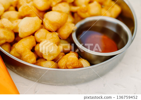 Traditional montenegro breakfast - donuts with honey. Close up. Traditional montenegro breakfast - donuts with honey. Close up. 136759452
