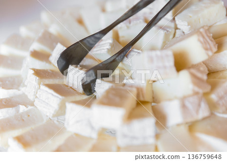 Pieces and cubes of cheese 136759648