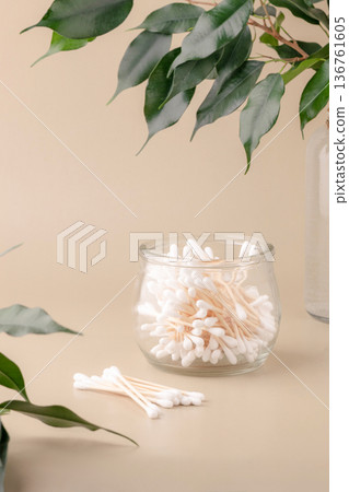 Eco-friendly bathroom essentials, bamboo toothbrushes, cotton swabs, reusable cotton pads, comb, facial brush. Green lifestyle, eco-consciousness Eco-friendly bathroom essentials, bamboo toothbrushes, cotton swabs, reusable cotton pads, comb, facial brush. Green lifestyle, eco-consciousness 136761605