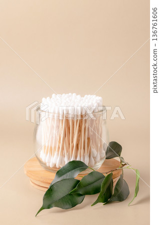 Eco-friendly bathroom essentials, bamboo toothbrushes, cotton swabs, reusable cotton pads, comb, facial brush. Green lifestyle, eco-consciousness 136761606