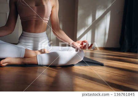 Yoga time, close up view of woman that is practicing at home Yoga time, close up view of woman that is practicing at home 136761845
