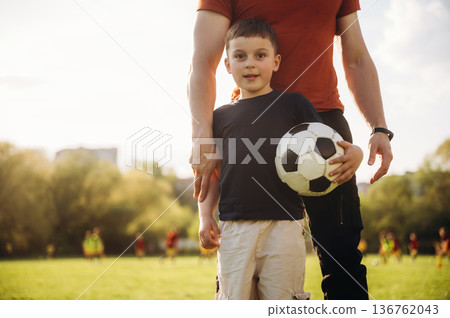 Father and son are having fun outdoors Father and son are having fun outdoors 136762043