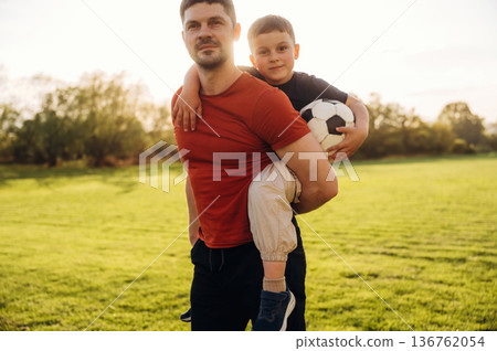 Father and son are having fun outdoors 136762054