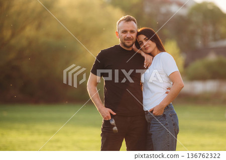 Couple of adults couple that are on the field Couple of adults couple that are on the field 136762322
